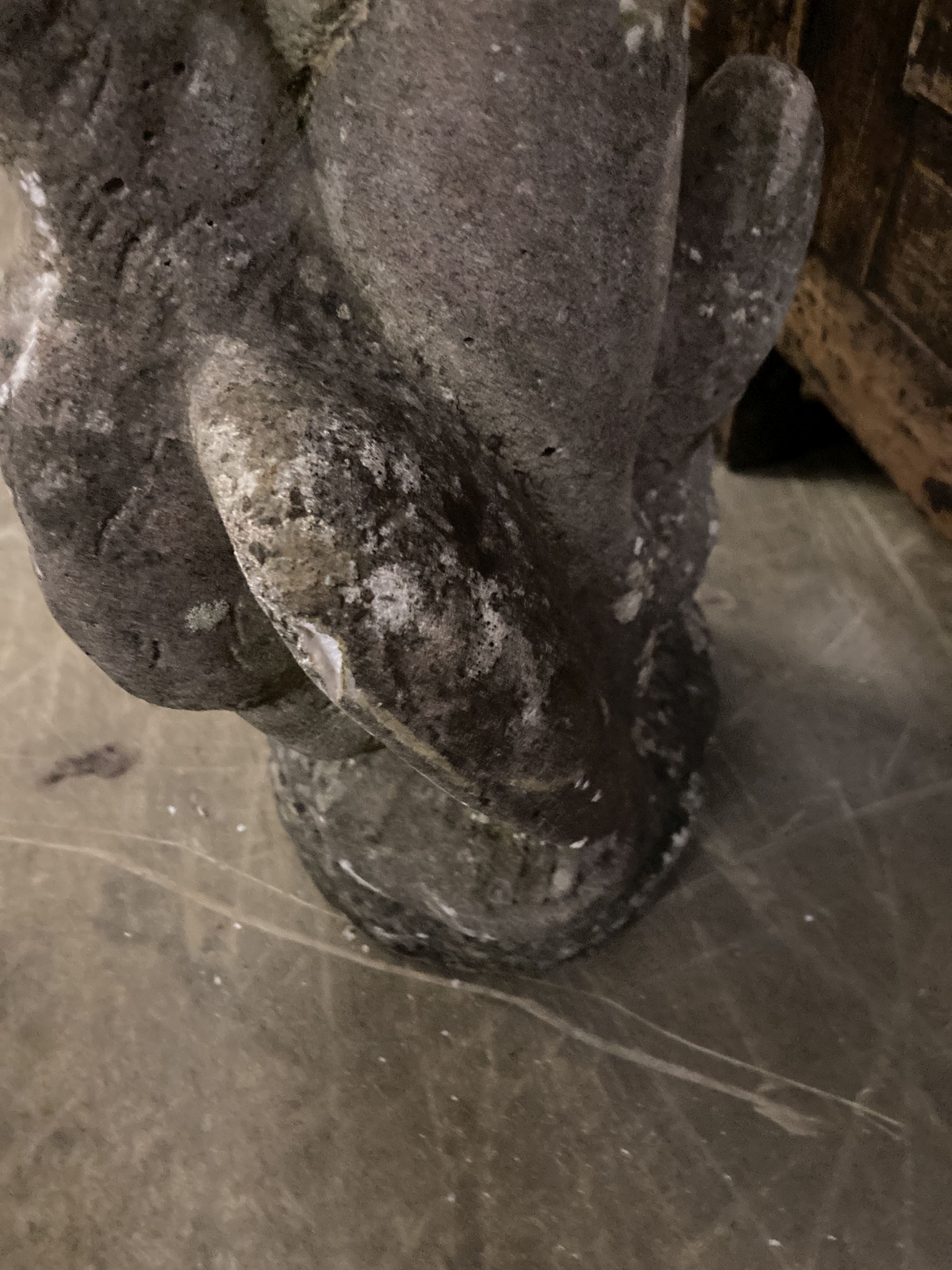 A reconstituted stone garden ornament of a putto with swan, height 68cm